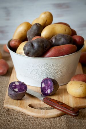 Various varieties of new,red and purple potatoesの写真素材