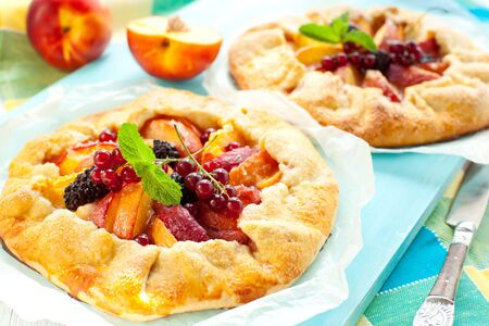 peach galette with blackberry and red currantの写真素材