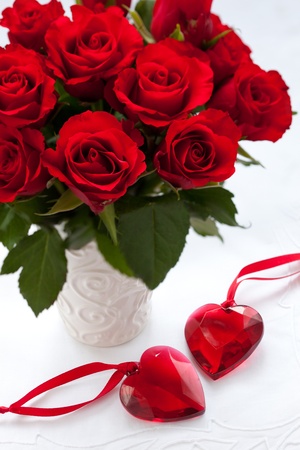 red roses in vase and hearts for Valentine's Dayの写真素材
