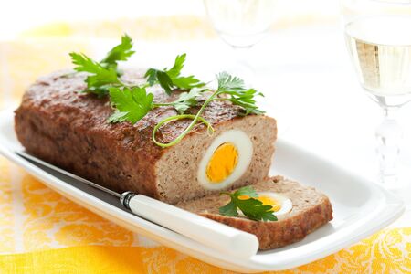 baked meatloaf with boiled eggs for Easterの写真素材