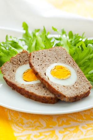 baked meatloaf with boiled eggs for Easterの写真素材