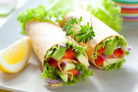 fresh  tortilla wraps with vegetables on the plateの写真素材