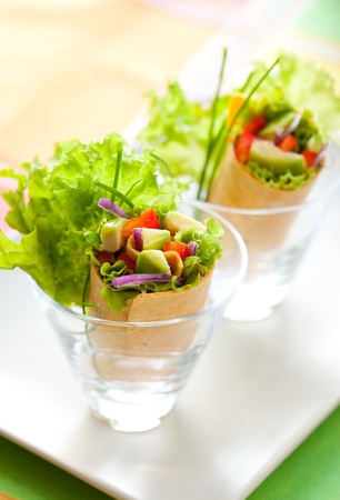 fresh  tortilla wraps with vegetables on the plateの写真素材