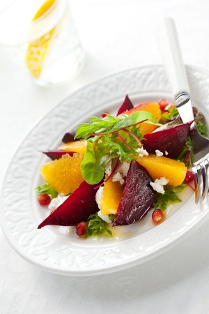 salad of beetroot,goat cheese,orange and pomegranateの写真素材