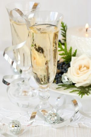 Two glasses of champagne with Christmas decorationsの写真素材