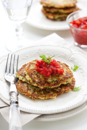 Zucchini pancakes with tomato salsaの写真素材