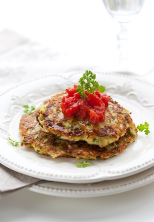 Zucchini pancakes with tomato salsaの写真素材