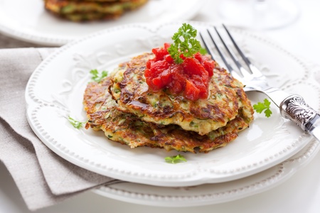 Zucchini pancakes with tomato salsaの写真素材