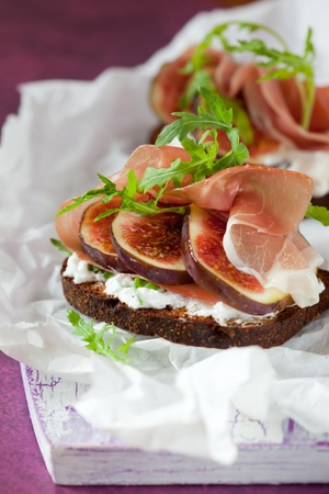 Sandwich with prosciutto, goat cheese and figの写真素材