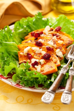 Roasted butternut squash salad with cheese,nut and cranberryの写真素材