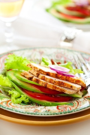Chicken salad with avocado and tomatoesの写真素材