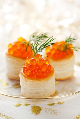 Vol-au-vents filled with red caviar and dill for holidayの写真素材