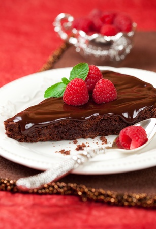 slice of chocolate cake with raspberryの写真素材