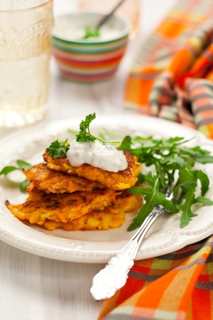 Carrot pancakes with rucola and  yoghurtの写真素材