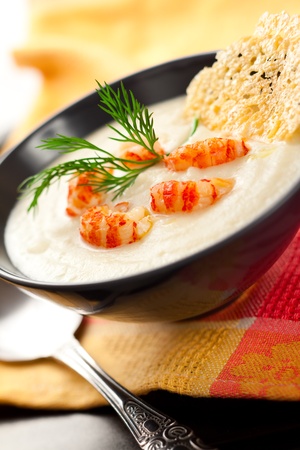 Cream of potato and celeriac soup with crab meat and parmesan crispsの写真素材