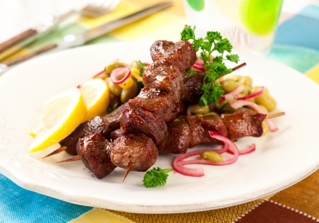 Grilled lamb kebabs with bean saladの写真素材