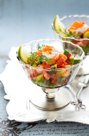 Shrimp, avocado, salmon and caviar cocktail  salad in a glassの写真素材