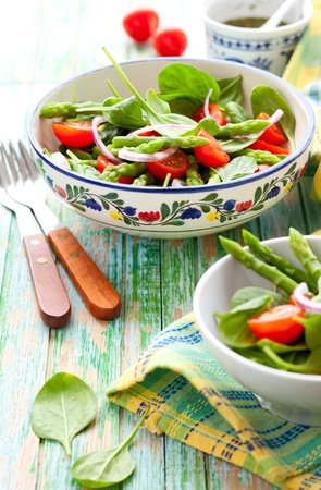 Spinach,tomato and  asparagus saladの写真素材