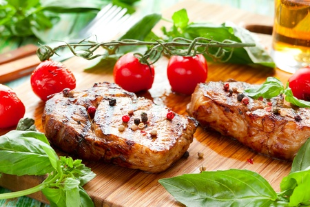 Grilled veal loin steak on cutting boardの写真素材