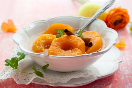 Peaches in syrup with spicesの写真素材