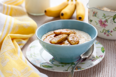 Porridge with honey and caramelised  bananasの写真素材