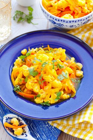 Cauliflower with saffron, carrot and orangesの写真素材