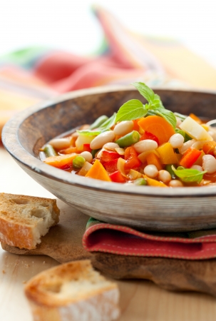 Bowl of minestrone soup with breadの写真素材