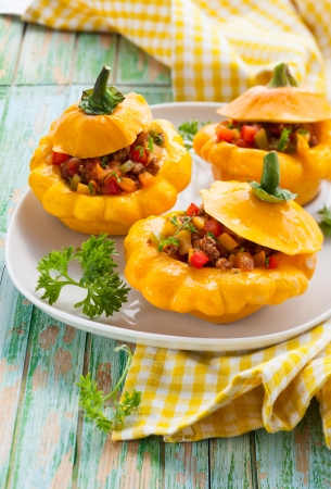 Pattypan squash stufeed with vegetables and meatの写真素材