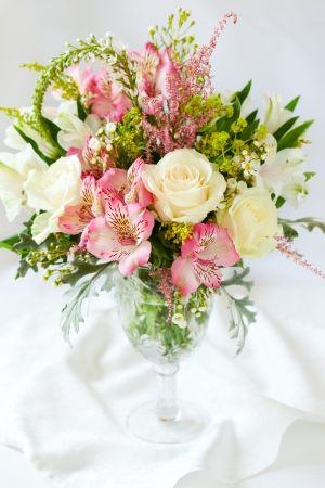 A festive  bouquet in a vase on the tableの写真素材