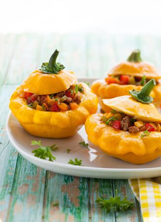 Pattypan squash stufeed with vegetables and meatの写真素材