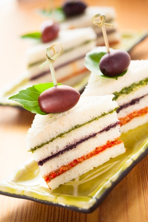 Tricolored sandwich stacks with different pestoの写真素材