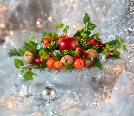 Christmas table decoration with fruit, nuts, fir branchesの写真素材