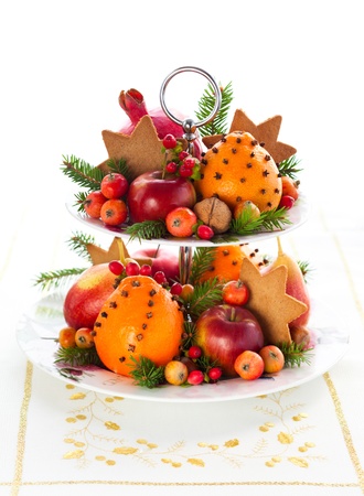 Christmas table decoration with fruits and cookiesの写真素材
