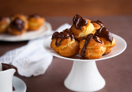 Profiteroles with cream and chocolate sauceの写真素材