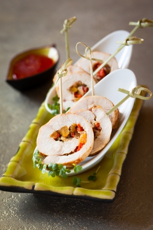 Poultry roulade filled with pumpkin and red pepperの写真素材