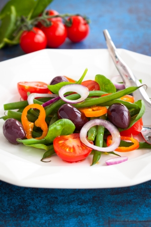 vegetable salad with green beans,tomatoes,olives and peppersの写真素材