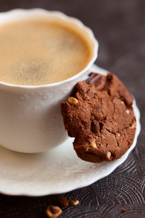 Chocolate and hazelnuts cookies with coffeeの写真素材
