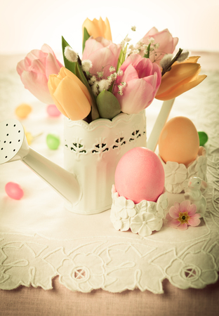 vintage style bouquet of spring flowers and eggs for Easterの写真素材