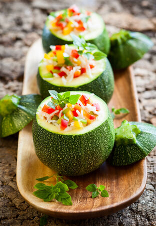 Round zucchini stuffed with vegetables and riceの写真素材