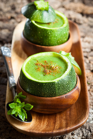Zucchini cream soup served in a round zucchiniの写真素材