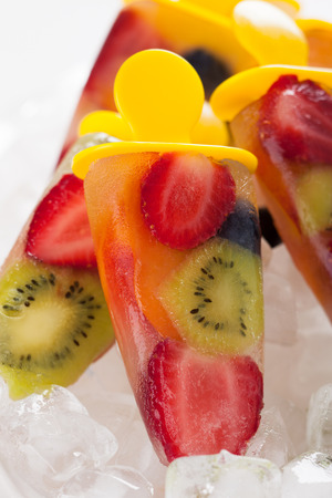 frozen strawberry,kiwi,peach and coconut water ice creamの写真素材
