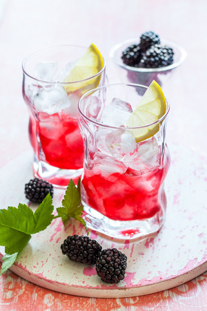 Blackberry Lemonade on a vintage wooden boardの写真素材