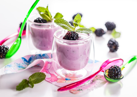 Fresh fruit yoghurt with blackberriesの写真素材
