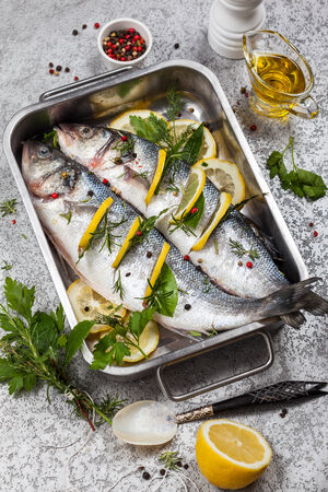 Sea bass with lemon,herbs and persian blue salt before cookingの写真素材
