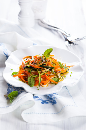 Zucchini and carrot salad with spicy dressingの写真素材
