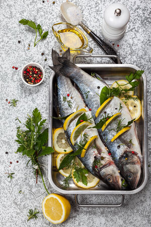 Sea bass with lemon,herbs and persian blue salt before cookingの写真素材
