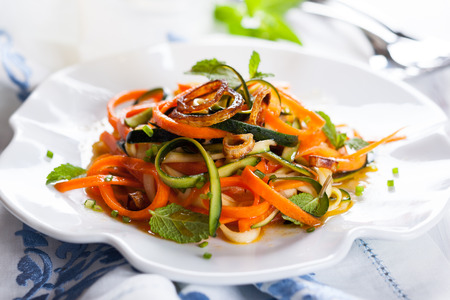 Zucchini and carrot salad with spicy dressingの写真素材
