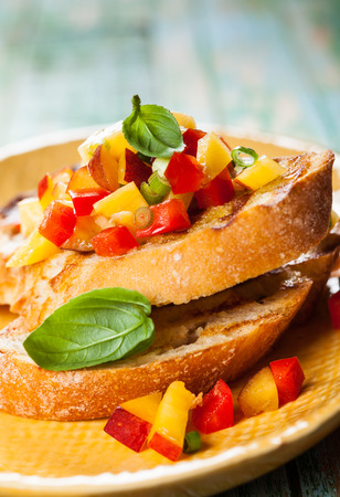Bruschetta with Peach Salsa on the plateの写真素材