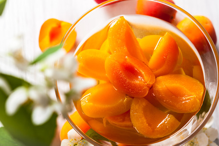 Fresh apricot compote in glass bowlの写真素材
