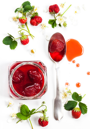 Strawberry jam and fresh berries on white backgroundの写真素材